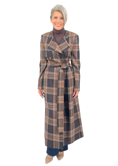 Woman wearing a plaid dress on a white background