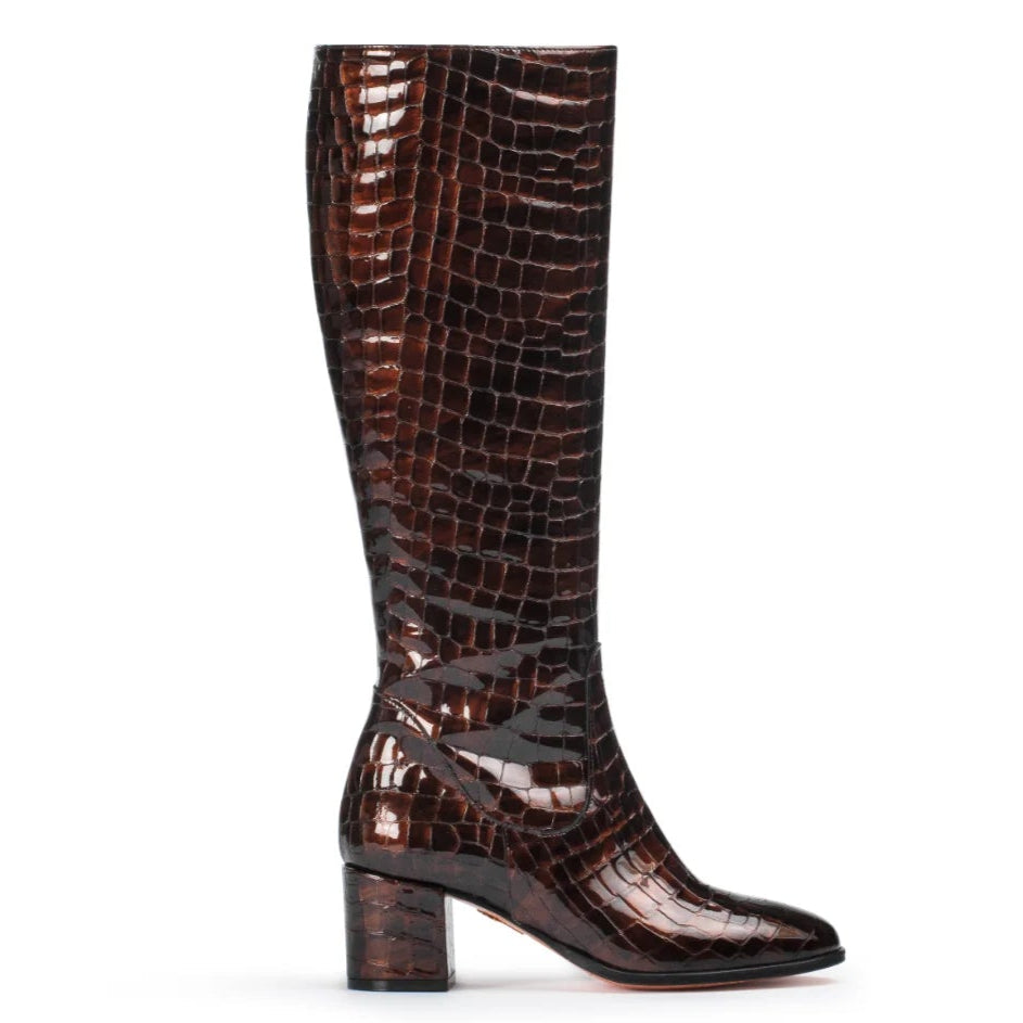 Brown knee-high boot with crocodile pattern on a white background