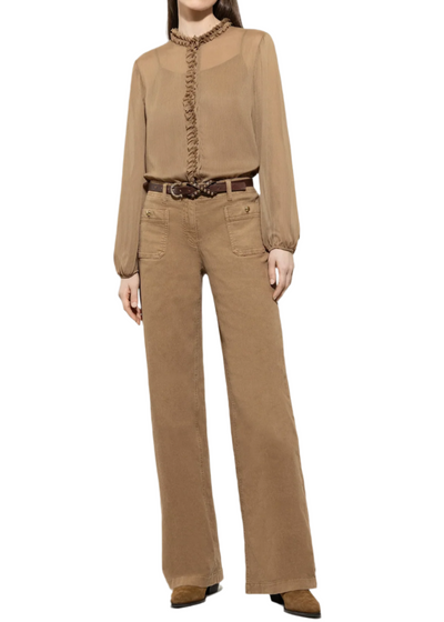 Person wearing a brown outfit with a shirt and pants on a white background